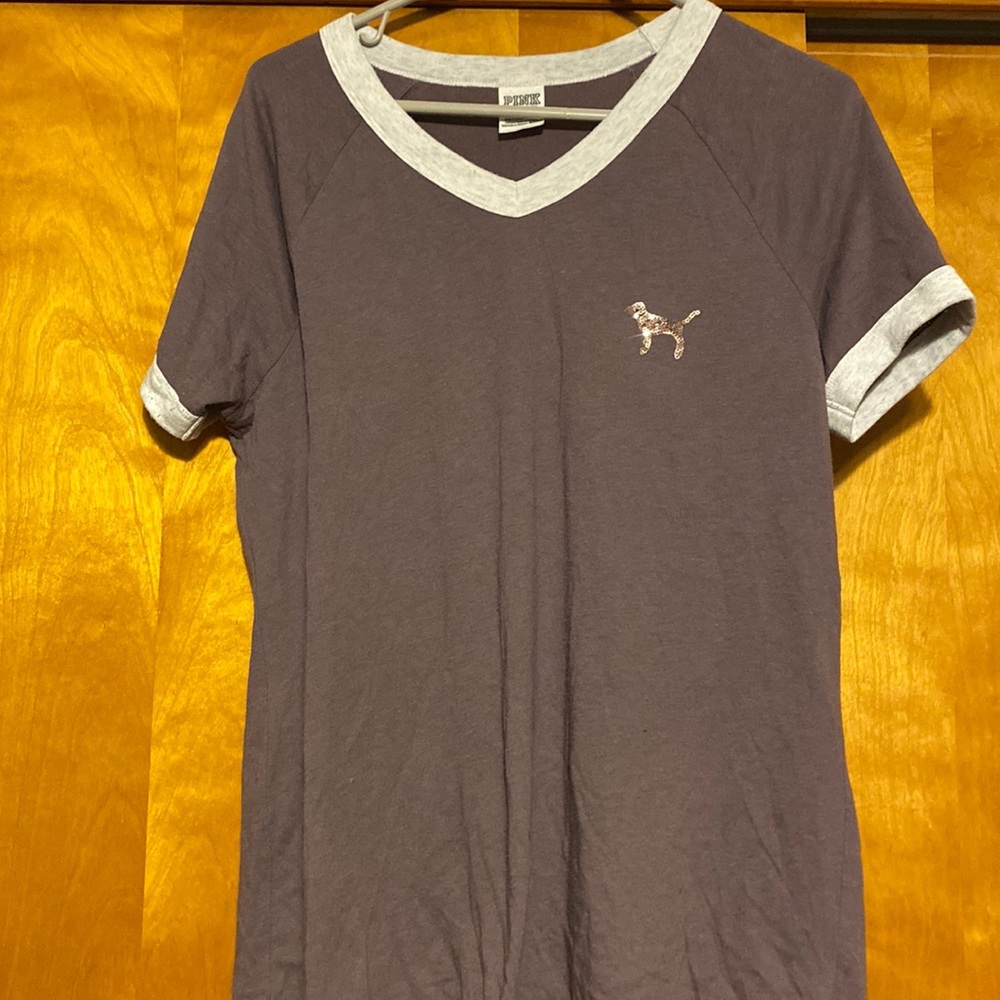 Woman's used Pink  T-shirt size medium does have stain on sleeve see picture